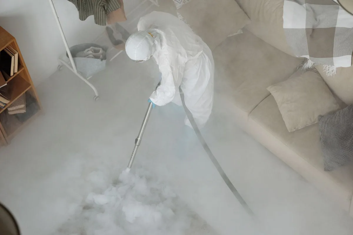Biohazard cleanup technician in protective equipment, Bellevue, IA